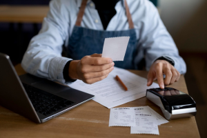 Retail manager calculating water bills