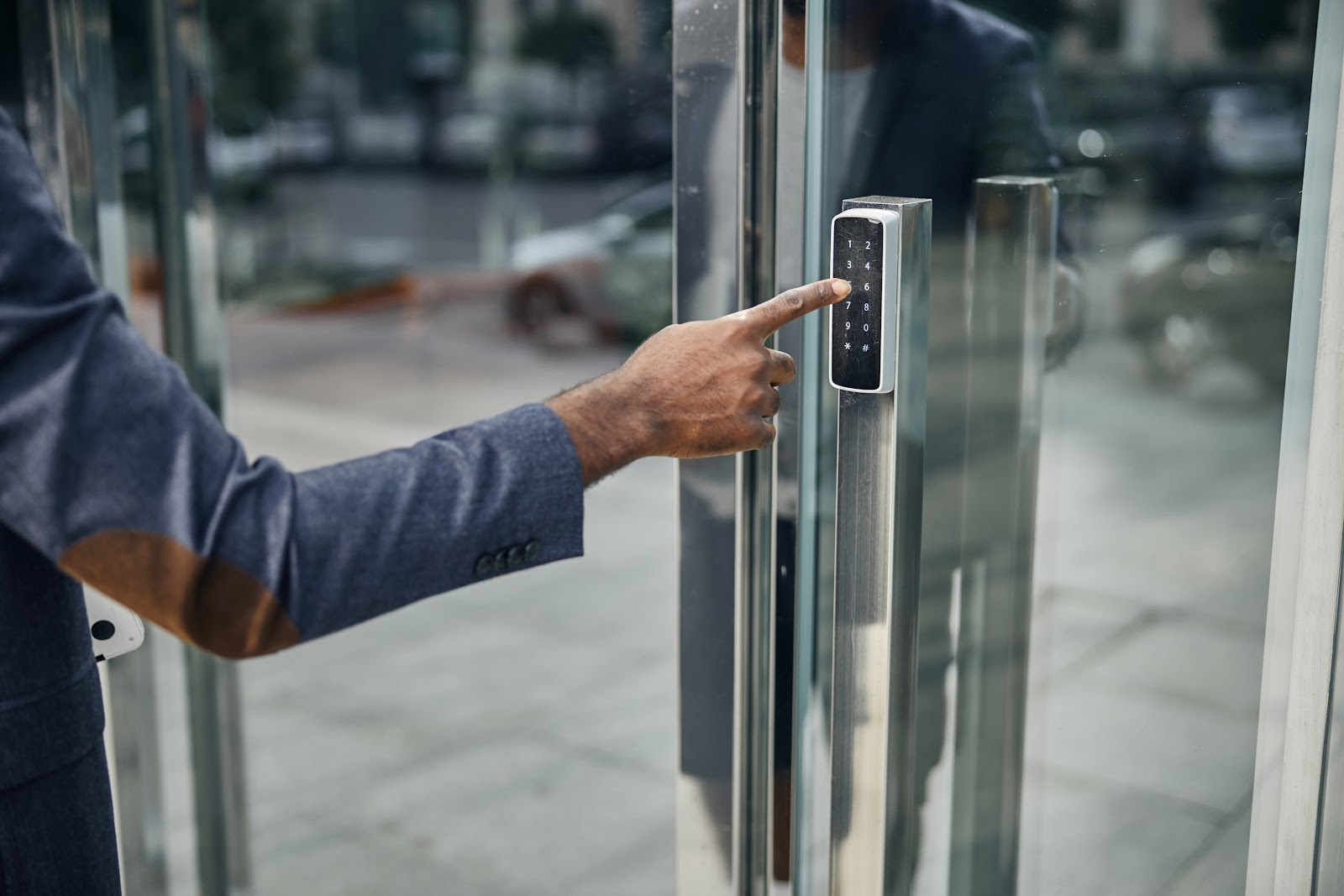 Person using a code to open commercial building doors