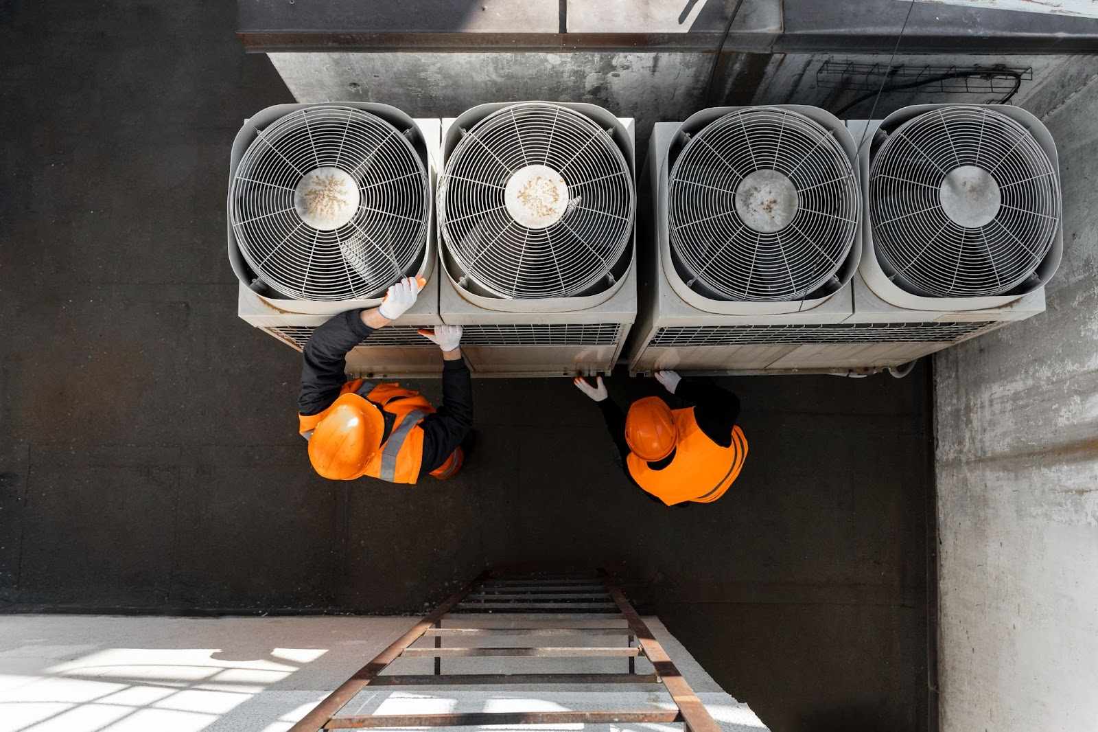 Technicians doing prenetative HVAC maintenance