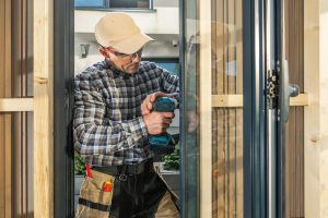 man fixing a door