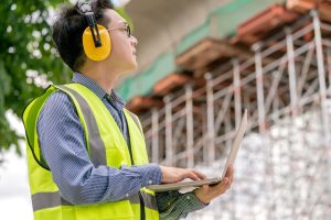 Technician using building maintenance software