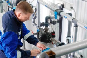 commercial plumbing maintenance worker